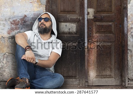 Portrait of young man on street