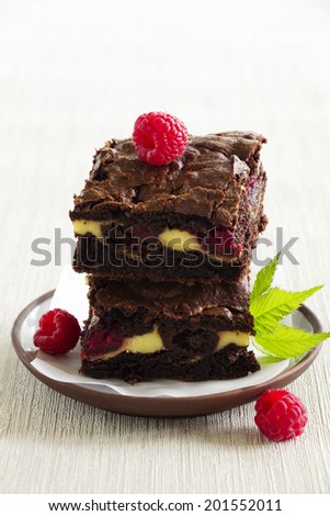 Chocolate brownie with raspberries and mascarpone.