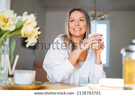 Similar – Image, Stock Photo Relaxed woman with cup of coffee in hammock