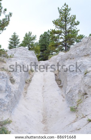 Oregon Trail, covered wagon ruts in white sandstone