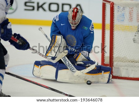 MINSK, BELARUS - MAY 19: IVANOV Alexei (28) of Kazakhstan saves the puck during 2014 IIHF World Ice Hockey Championship match at Minsk Arena on May 19, 2014 in Minsk, Belarus.