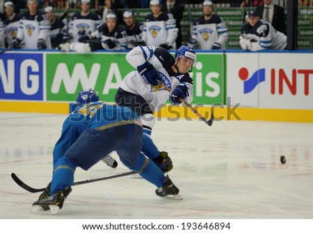 MINSK, BELARUS - MAY 19: LEHTERA Jori (21) of Finland shoot the puck during 2014 IIHF World Ice Hockey Championship match at Minsk Arena on May 19, 2014 in Minsk, Belarus.