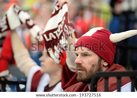 MINSK, BELARUS - MAY 19: Fans of Latvia looks dejected during 2014 IIHF World Ice Hockey Championship match on May 19, 2014 in Minsk, Belarus.