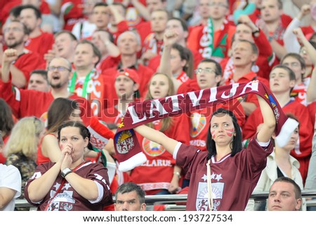 MINSK, BELARUS - MAY 19: Fans of Latvia looks dejected during 2014 IIHF World Ice Hockey Championship match on May 19, 2014 in Minsk, Belarus.