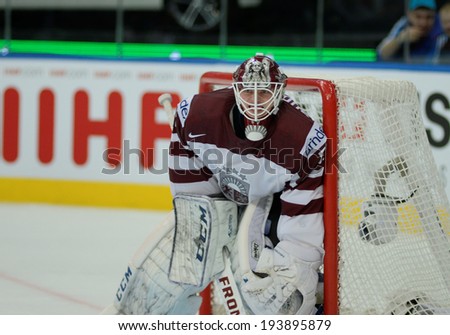 MINSK, BELARUS - MAY 20: GUDLEVSKIS Kristers of Latvia looks on during 2014 IIHF World Ice Hockey Championship match on May 20, 2014 in Minsk, Belarus