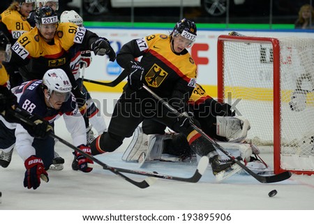 MINSK, BELARUS - MAY 20: MUELLER Peter of USA, MULLER Moritz of Germany and WEISS Alexander of Germany(R) during 2014 IIHF World Ice Hockey Championship match on May 20, 2014 in Minsk, Belarus