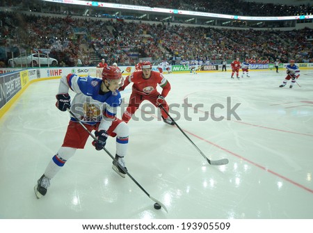 MINSK, BELARUS - MAY 20: SHIPACHYOV Vadim of Russia and GRABORENKO Roman of Belarus battle for the puck during 2014 IIHF World Ice Hockey Championship match on May 20, 2014 in Minsk, Belarus.