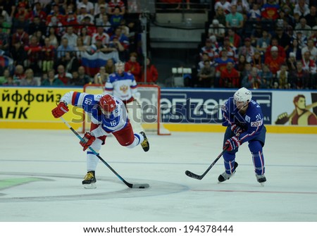 MINSK, BELARUS - MAY 22: PLOTNIKOV Sergei of Russia shoot the puck during 2014 IIHF World Ice Hockey Championship quarterfinal match on May 22, 2014 in Minsk, Belarus.