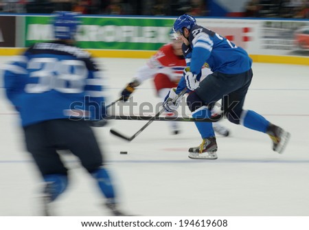 MINSK, BELARUS - MAY 24: KONTIOLA Petri (27) of Finland skates with the puck during 2014 IIHF World Ice Hockey Championship semifinal match at Minsk Arena on May 24, 2014 in Minsk, Belarus.