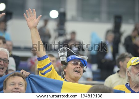 MINSK, BELARUS - MAY 25: Fans of Sweden celebrates after 2014 IIHF World Ice Hockey Championship match at Minsk Arena