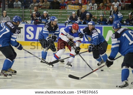MINSK, BELARUS - MAY 25: MALKIN Yevgeni (11) of Russia and HIETANEN Juuso (38) of Finland battle for the puck during 2014 IIHF World Ice Hockey Championship final at Minsk Arena