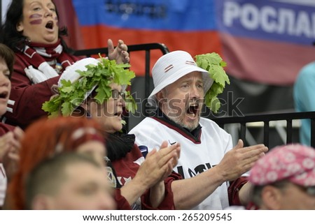 MINSK, BELARUS - MAY 17: Fan of Latvia during 2014 IIHF World Ice Hockey Championship match at Minsk Arena on May 17, 2014 in Minsk, Belarus.