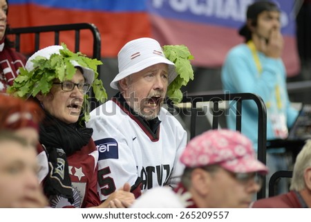 MINSK, BELARUS - MAY 17: Fans of Latvia during 2014 IIHF World Ice Hockey Championship match at Minsk Arena on May 17, 2014 in Minsk, Belarus.