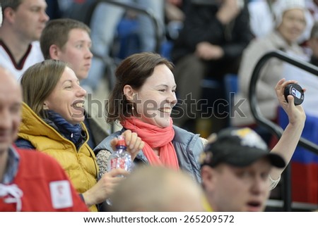 MINSK, BELARUS - MAY 17: Fan of Russia  show puck during 2014 IIHF World Ice Hockey Championship match at Minsk Arena on May 17, 2014 in Minsk, Belarus.