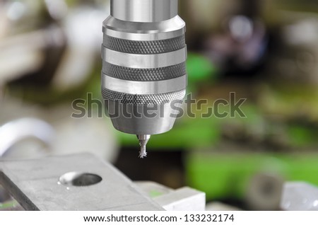 Drill machine closeup. Macro shot from slight high angle
