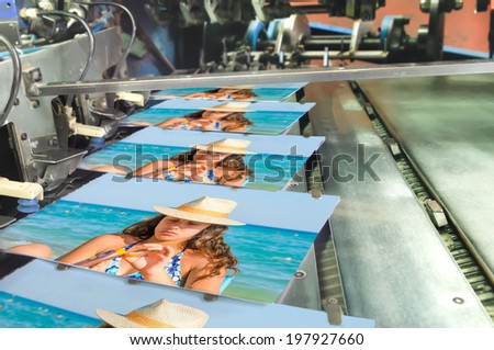 Book, magazine, catalog production line into press plant house. stitching cover with the spline.