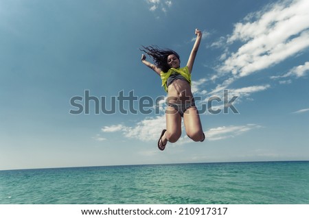 Water horizon happy teen jump. Happy teen smiling jump isolated on sea clear water horizon and blue sky, VINTAGE