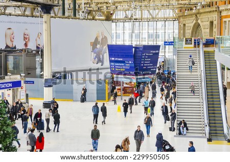 London, UK - Nov 26: The main departures board and concourse at Waterloo Railway Station on 26th November, 2014. Based on people entering or leaving, Waterloo has almost 96m users per year