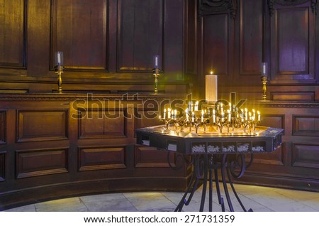 Religion candles with flame inside the church