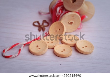 Vintage wooden bobbin thread and buttons.