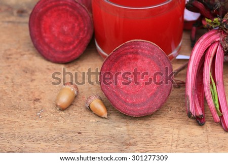 fresh vegetables beetroot juice and a tape measure