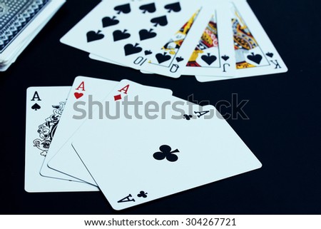 Playing cards on black background