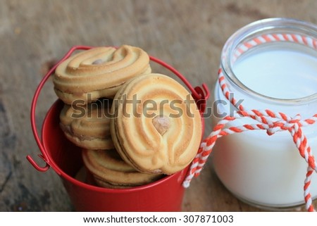 tasty cream cookies and milk