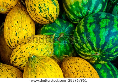 watermelons and melons selling in marketplace