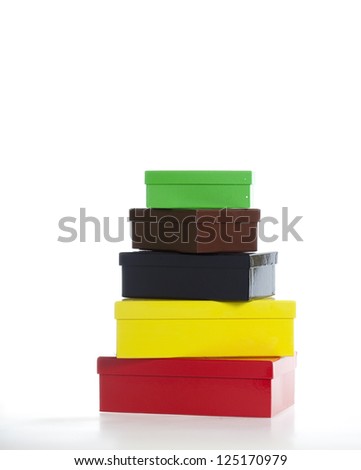 Five multi-colored boxes isolated on white - part of a series of images with eight boxes stacked upon each other sequentially.