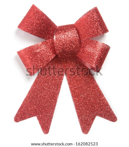 Ornamental decoration bow tie for Christmas presents, red, shiny, sparkling. Isolated on white background.