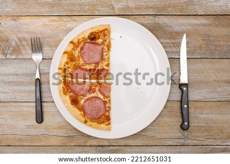 Similar – Foto Bild Ein Pizzastück und Reste. Salami-Pizzastück, Krustenreste