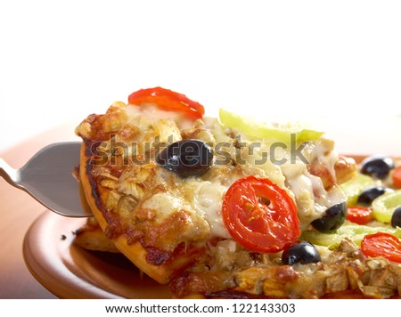 .home pizza with tomato and eggplant  Closeup .taking slice of pizza,melted cheese dripping. isolated on white background.