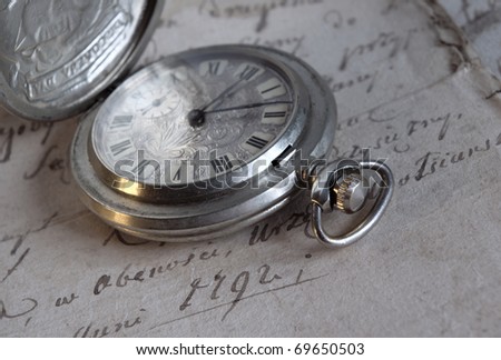 Old-time watch,current of time,handwritten documents