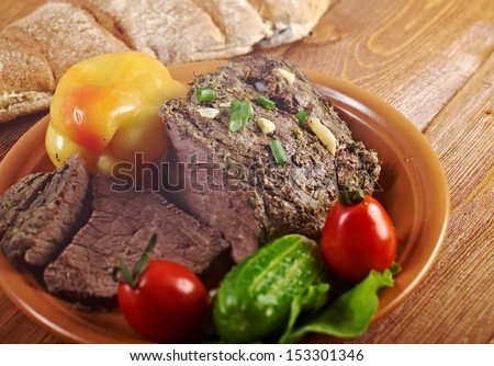roast beef farm-style  with vegetable and bread .farmhouse kitchen