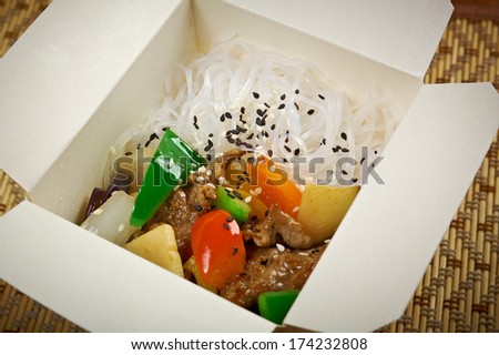 Chinese rice noodles, meat and oyster sauce .chinese cuisine in take-out box
