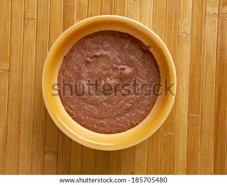 Refried beans dish of cooked and mashed beans and is a traditional staple of Mexican and Tex-Mex cuisine
