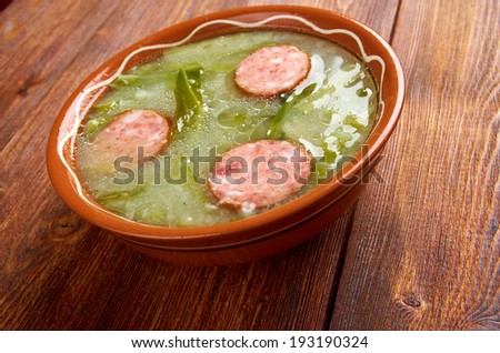 Caldo verde popular soup in Portuguese cuisine. traditional ingredients for caldo verde are potatoes, collard greens , olive oil and salt. Additionally garlic or onion may be added.