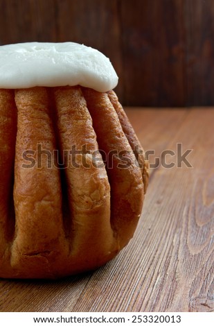 Rum baba  on wooden background. cake saturated in hard liquor, usually rum, and sometimes filled with whipped cream or pastry cream.