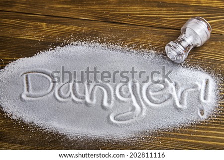 DANGER written on a heap of salt - Health Hazard
