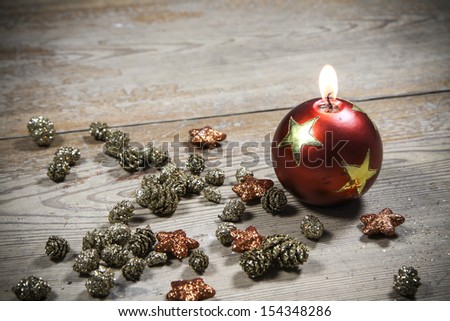 beautiful christmas decoration candle - on the wooden floor