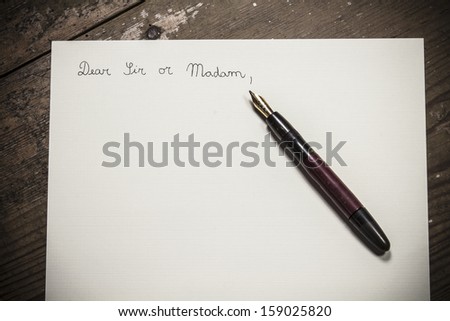 Old fashioned letter with a pen