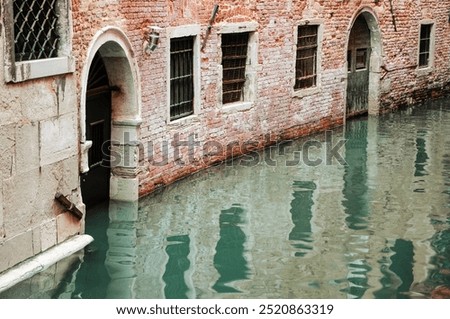 Similar – Image, Stock Photo Serene canal in old city district with aged buildings