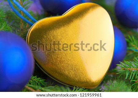 Christmas card with gold heart, balls and spruce twig