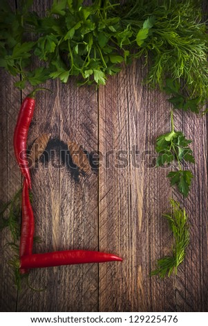 Art vintage background with early vegetables on wooden board
