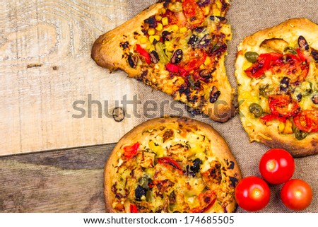 Closeup of a heavily toasted slices of pizza