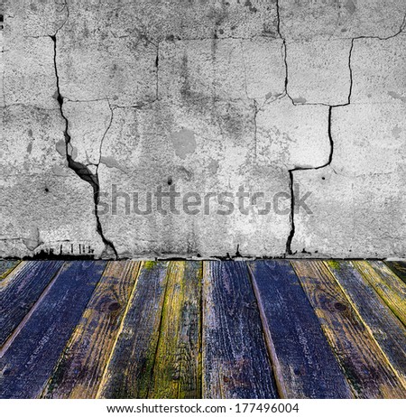 Grunge stone wall and painted wooden floor