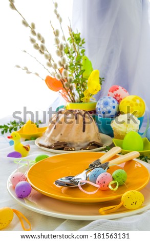 Serving Easter table with cake and eggs