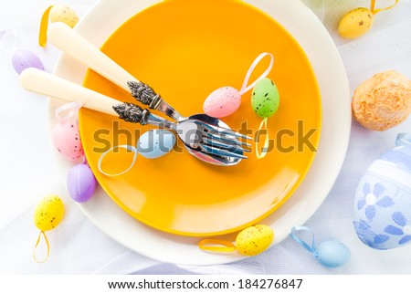 Closeup of Easter place setting with eggs