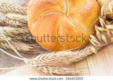 Different bakery products among the ears of cereals