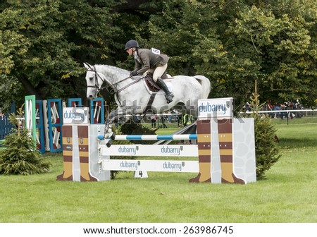 Burghley, Stamford/UK - September 5, 2014: Samantha Jimmison takes Ebolensky for a victory jump over the Dubarry fence after claiming the top spot in the Duybarry Burghley Young Event Horse.